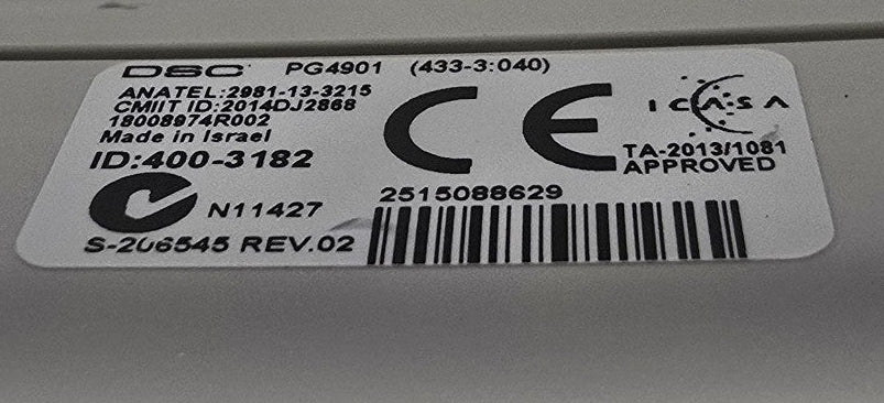 Close-up of a label on a metallic surface with visible CE marking.