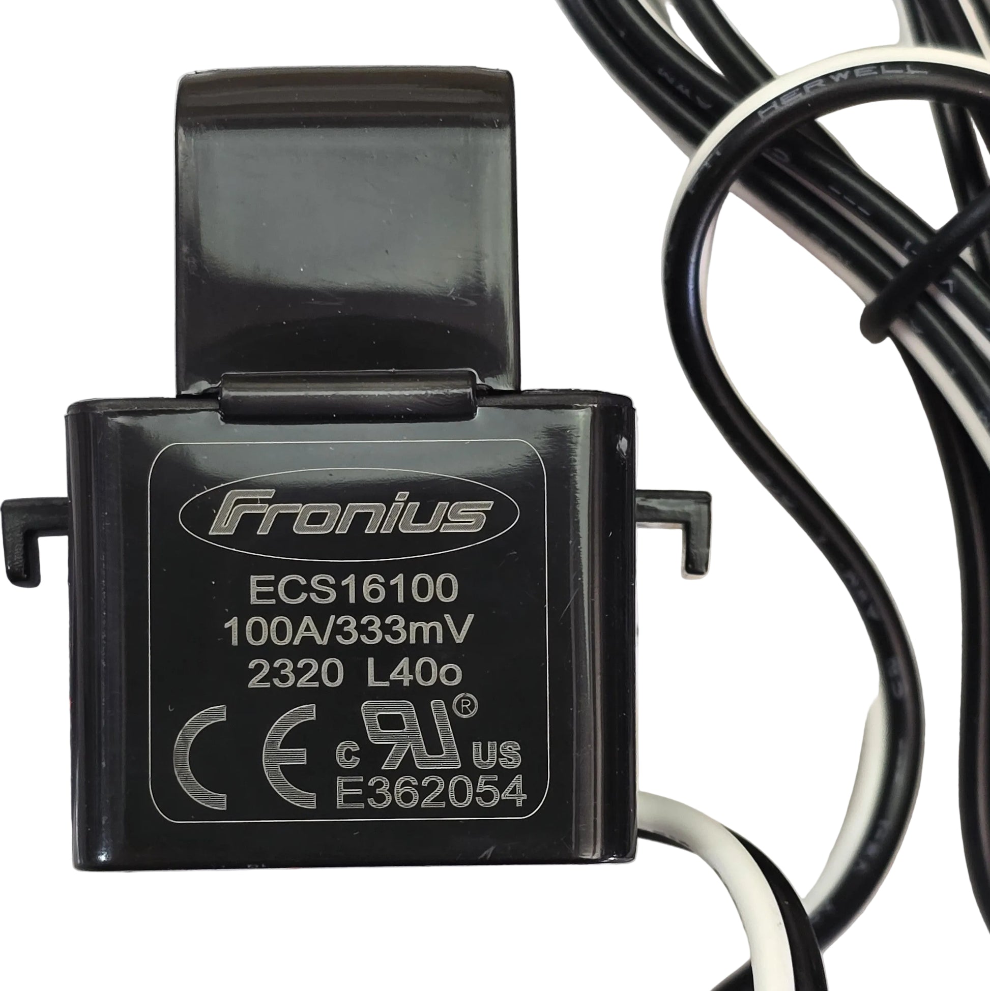 A black Fronius ECS16100 electrical charger module with printed specifications and certification logos, shown with attached cables on a light surface.