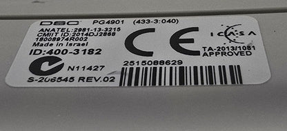 Close-up of a label on a metallic surface with visible CE marking.